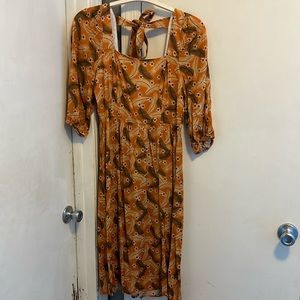 Beautiful orange floral dress with zipper back and a tie across shoulders